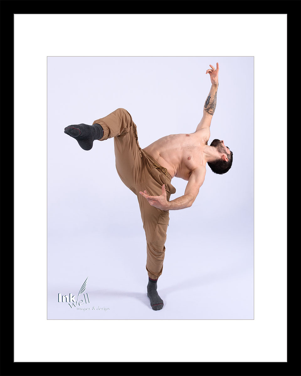 Male dancer arched back leg forward