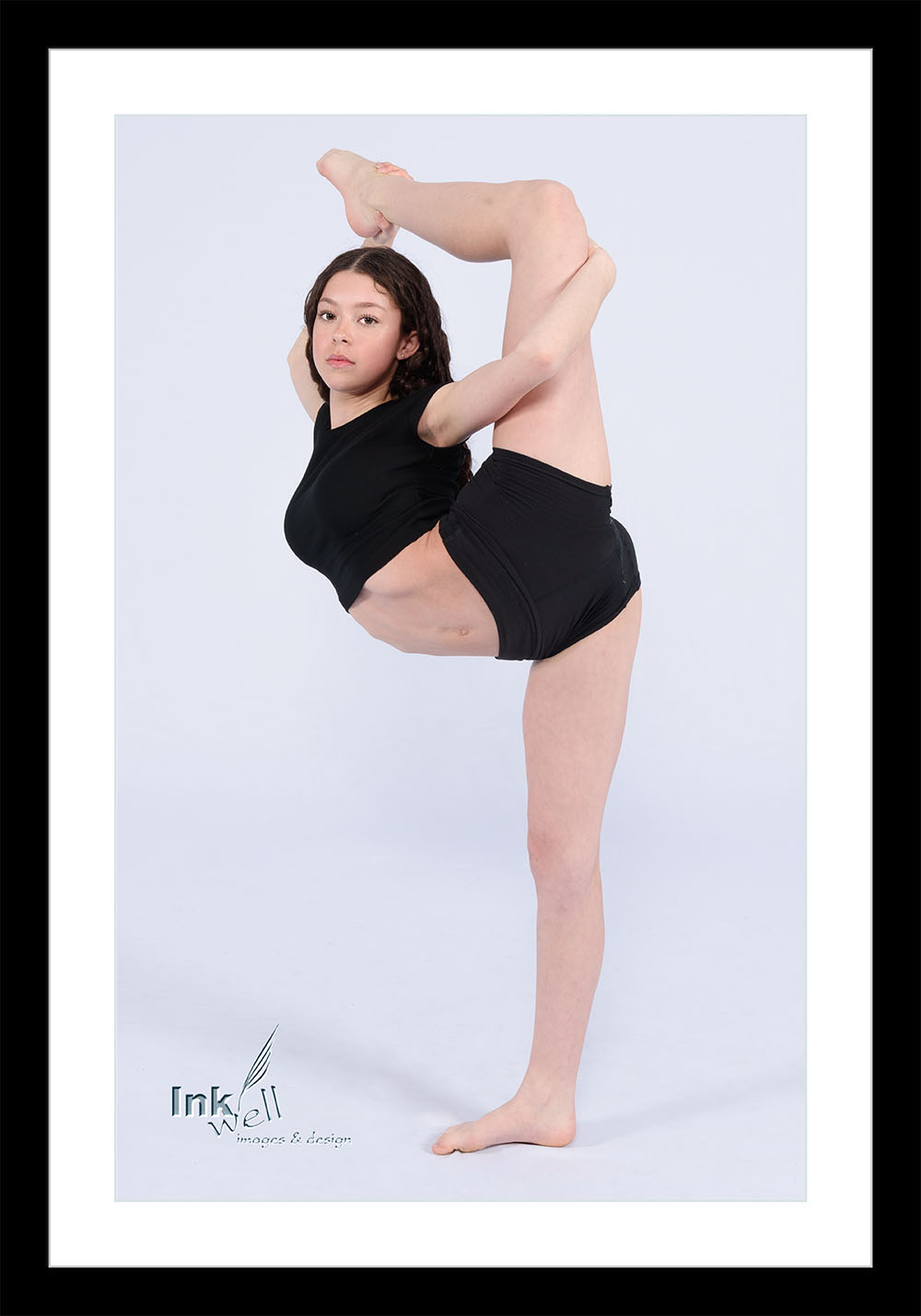 Portrait of a Dancer holding her leg vertically