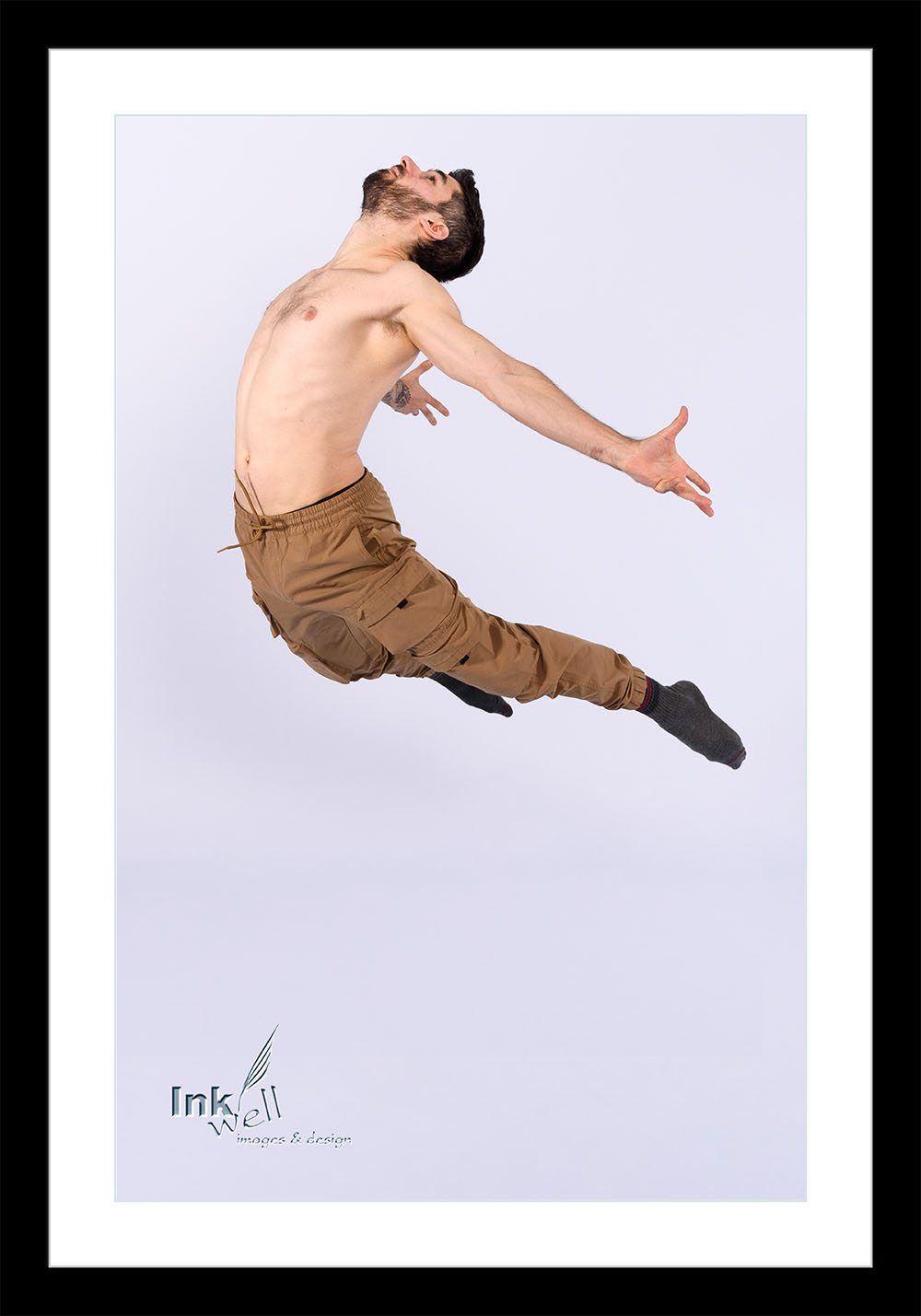 A male dancer leaping with arched back