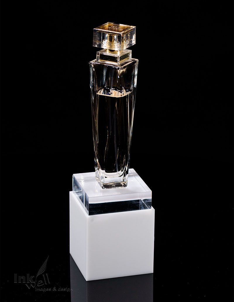 sample product photograph of a perfume bottle on stand